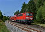 111 206 schiebt einen RE nach Nürnberg Hbf am 23.08.2012 durch Laaber.
