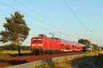 RE 5 trifft RB 12.	  Die 112 123 mit dem RE 5 nach Stralsund trifft am 28.06.2019 den Talent der NEB auf der RB 12 nach Berlin Ostkreuz in Nassenheide.