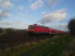 112 151-6 f�hrt am 19.12.08 mit RE 21421 L�beck Hbf - Hamburg Hbf nach kurzem Halt in Reinfeld (Holst.) seinem n�chsten Halt Bad Oldesloe entgegen.