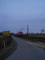 RE 21425 L�beck Hbf - Hamburg Hbf gezogen von einer 112 rast am 22.01.09 bei Altenfelde Richtung Reinfeld (Holst.) um dort einen Planhalt einzulegen.