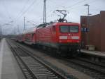 Von Sassnitz bis nach Rostock schob 112 111,am 05.Februar 2013,den RE 13012.Hier beim Halt in Bergen/R�gen.