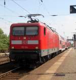 112 134-2 mit S1 von Rostock Hbf nach Warnem�nde kurz vor der Ausfahrt in Rostock-Bramow.03.08.2013