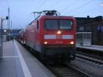 Am 09.Dezember 2013 hielt die Rostocker 112 190,mit dem RE 13012 Sassnitz-Rostock,in Bergen/Rügen.