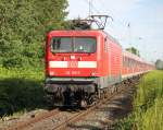 Die ex Kieler 112 155-7 mit Sonderzug von Warnem�nde nach Berlin bei der Durchfahrt um 08:25 Uhr in Rostock-Bramow.20.07.2014 