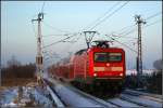112 118 mit dem RE1 aus Rostock nach Hamburg am 04.12.10 in Sildemow.