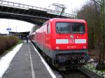 BR 112 155-7 als Schublok fr den SCHLESWIG-HOLSTEIN EXPRESS an einem grauen Dezembertag in Flensburg.