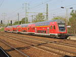 Einfahrt RE 7 nach Dessau Hauptbahnhof in den Bahnhof Berlin Schönefeld Flughafen am 28. April 2020. Schublok war 112 179.