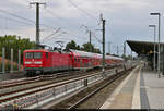 112 117-7 passiert den Bahnhof Berlin-Karow.