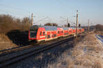 Ein RE3 nach Lutherstadt Wittenberg, geschoben von einer Lok der Baureihe 112. Aufgenommen am 14.12.2022 in Schmargendorf.