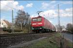 112 158 schiebt bei Westhofen den RE7 (RE 29726)  Rhein-Mnsterland-Express  nach Rheine. (29.03.2008)