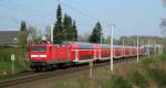 112 167-2 wird gleich mit RE 21423 den B  Kalkgraben  in Reinfeld (Holst.) berqueren. Aufgenommen am 15.04.09 in Reinfeld (Holst.).