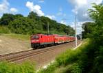 112 113 mit einem RE nach Berlin am 22.07.2012 bei Frankfurt-Rosengarten.