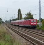 112 182 schiebt am 24.09.2014 einen RE durch Berlin-Karow.