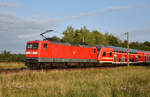 112 113-6 schiebt den Hanse-Express RE1 in Richtung Schwerin.