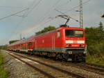 08.08.2008, bei Chorin: Lok 114 040 befördert RE 38356 Elsterwerda - Stralsund durch den Regenbogen.