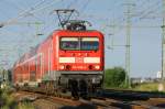 114 009 mit RE von Ludwigslust nach Wismar bei der Einfahrt in den Bf. Holthusen. 29.06.2007