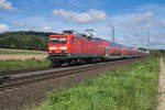 114 009-4 ist als RE in Richtung Frankfurt/M. am 14.09.2023 bei Kerzell unterwegs.