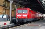 Frisch lackiert steht am 28.12.08 114 301 mit einer RB im Hbf Halle(S).