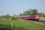 Am 29.04.2011 fhrt 114 039 mit einem RE 3 Richtung Berlin, hier bei Chorin.