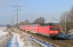 114 033-4 fhrt am 03.02.2012 durch Diedersdorf mit dem RE3 nach Elsterwerda.