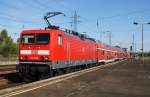 Hier 114 033 mit einem RE7 (RE18257) von Wünsdorf-Waldstadt nach Berlin Zoologischer Garten, bei der Ausfahrt am 3.10.2012 aus Berlin Schönefeld Flughafen. 