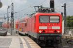114 030 am 3.8.12 mit einem RE bei der Einfahrt in Berlin Hbf.