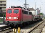 115 205 mit Autotransportwagen am 30.7.2008 in Mnchen.