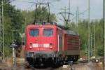 Die 140 687-4 und eine uninteressante BR 189 rangieren in Kln Gremberg am 26.07.2009