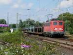140 590-1 bei der Durchfahrt durch Grevenbroich mit einem leeren Autotransportzug.