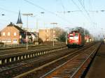 Drei Lackierungen der BR 140: 140 333-5 mit einem Lokzug auf Bahnhof Salzbergen am 24-2-2003.