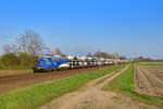 140 759 mit einem Autozug am 16.04.2019 bei Woltorf.