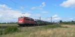 140 012 mit Autotransportzug nach Mhlacker in Waghusel.