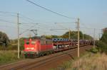 140 857-4 mit einem Ganzzug Autotransportwagen in Magdeburg Diesdorf.