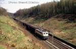 140273 mit Güterzug Richtung Osnabrück am 24.4.1988 um 14.44 Uhr zwischen Ostercappeln und Vehrte.