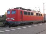 140 640-4 am 22.04.2005 mit einem Containerzug in Nauen (Gleis 2).