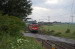 140 037-3 mit einem sehr lückenhaft beladenem Millionenzug, hier am 27.05.2011 zwischen Benhausen und Neuenbeken.