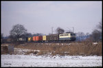 140240 mit einem Güterzug Richtung Osnabrück am 24.02.1996 um 10.30 Uhr am Ortsrand von Hasbergen.