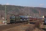 Mit einem Autozug fhrt 142 001-7 der MTEG durch das Elbtal in Richtung Dresden. Fotografiert am 09.02.2011 in Knigstein.  