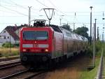 143 210-3 kommt hier mit der RB14 in den Bahnhof von Lbbenau/Spreewald reingefahren.
