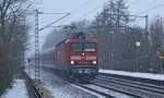 143 343-2 mit einer RB nach Hamburg-Altona am 4.01.2010 bei Schneetreiben in Prisdorf.