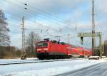 Bei 143 566-8 schlug die Fotowolke zu. Gesehen am 03.02. in Richtung Calau durch Bestensee.