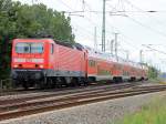 143 306-9 am 26. Juni 2011 mit dem RB 14  (RE 18921) von Nauen nach Berlin-Schnefeld Flughafen durchfhrt den Bezirk Altglienicke in Berlin.