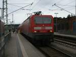 143 233 mit dem RE 13010 Sassnitz-Rostock,am 01.August 2013,in Bergen/Rgen.