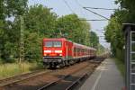 Eine morgendliche RB von Itzehoe nach Hamburg-Altona erreicht am 2.07.2010 den Haltepunkt Prisdorf.