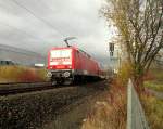 Ein gedrehter RE 3 nach Dresden mit der 143 973 und ihren neuen Puffern in Plauen bei kurzer Wolkenlücke angestrahlt. Gesehen am 16.11.2014