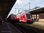 Im Juni diesen Jahres treffen sich 143 299 und ein InterRegioExpress der Relation Bad Kleinen <-> Jterbog im Bahnhof Schwerin.