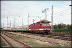 DR 243145 fährt hier mit einer stilreinen Reichsbahn Garnitur, dem D 715 nach Leipzig, um 12.48 Uhr am 3.10.1991 aus Stralsund aus.