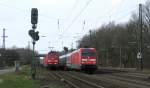 101 112-1 berholt am 31.03.09 151 031-2 die mit einem Containerzug in Radbruch auf einem Ausweichgleis wartet.