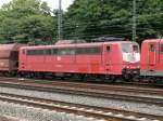 Die sichtlich schon arg mitgenommene 151 134-4 mit Ltzchen in orientrot befand sich als zweite Lok in diesem Gterzug, der am 18/07/2009 durch Kln-West fuhr.