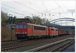 155 073-0 der DB Schenker Rail Deutschland AG fährt am 21.12.2013, mit der kalten 151 048-6 und einem Coil-Güterzug am Haken,vom Güterbahnhof Kreuztal in Richtung Hagen.